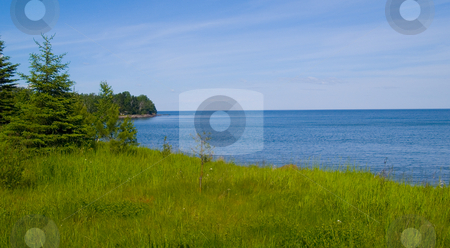 To use this stock image in your creative project, please select the size you need over to the right and click the "Add to Cart" button.
Your downloaded image will come with the Cutcaster watermark removed so don’t worry about the watermark you see on this page. Flood Bay Spring stock photo, Flood Bay along the North shore of Lake Superior in lush Spring greens by John McLaird