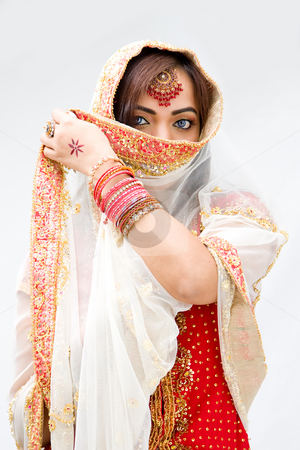 To use this stock image in your creative project, please select the size you need over to the right and click the "Add to Cart" button.
Your downloaded image will come with the Cutcaster watermark removed so don’t worry about the watermark you see on this page. Woman with veil stock photo, Elegant Bengali bride with veil in front of mouth, isolated by Paul Hakimata