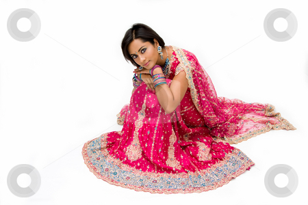 To use this stock image in your creative project, please select the size you need over to the right and click the "Add to Cart" button.
Your downloaded image will come with the Cutcaster watermark removed so don’t worry about the watermark you see on this page. Beautiful Bangali bride sitting stock photo, Beautiful Bangali bride in colorful dress sitting, isolated by Paul Hakimata