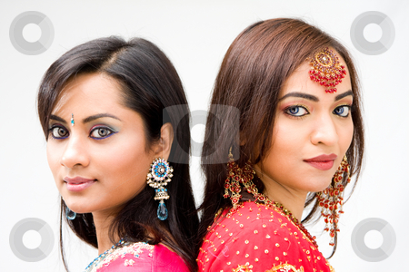 To use this stock image in your creative project, please select the size you need over to the right and click the "Add to Cart" button.
Your downloaded image will come with the Cutcaster watermark removed so don’t worry about the watermark you see on this page. Beautiful Bengali brides stock photo, Two beautiful Bengali brides in colorful dresses, isolated by Paul Hakimata