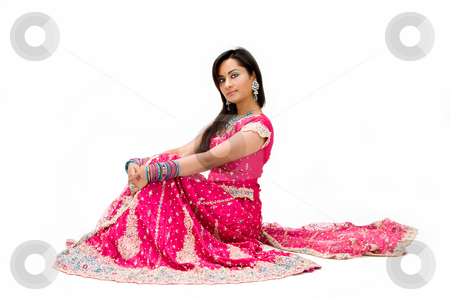 To use this stock image in your creative project, please select the size you need over to the right and click the "Add to Cart" button.
Your downloaded image will come with the Cutcaster watermark removed so don’t worry about the watermark you see on this page. Beautiful Bangali bride sitting stock photo, Beautiful Bangali bride in colorful dress sitting, isolated by Paul Hakimata
