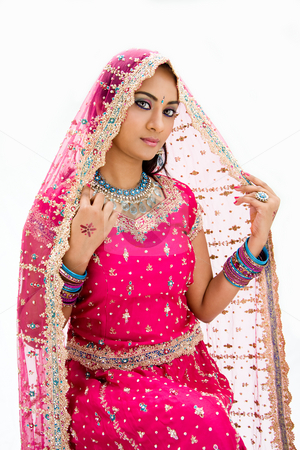 To use this stock image in your creative project, please select the size you need over to the right and click the "Add to Cart" button.
Your downloaded image will come with the Cutcaster watermark removed so don’t worry about the watermark you see on this page. Beautiful Bangali bride stock photo, Beautiful Bangali bride in colorful dress and veil, isolated by Paul Hakimata