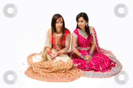 To use this stock image in your creative project, please select the size you need over to the right and click the "Add to Cart" button.
Your downloaded image will come with the Cutcaster watermark removed so don’t worry about the watermark you see on this page. Harem girls stock photo, Two beautiful harem girls or belly dancers or Hindu brides sitting, isolated by Paul Hakimata