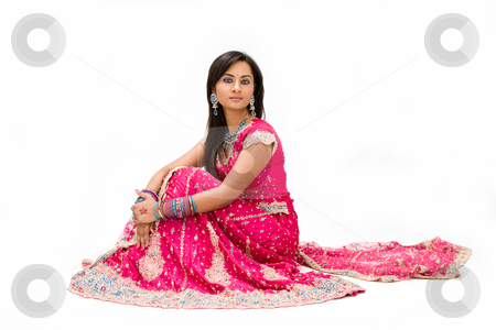 To use this stock image in your creative project, please select the size you need over to the right and click the "Add to Cart" button.
Your downloaded image will come with the Cutcaster watermark removed so don’t worry about the watermark you see on this page. Beautiful Bangali bride sitting stock photo, Beautiful Bangali bride in colorful dress sitting, isolated by Paul Hakimata