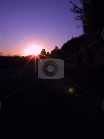 To use this stock image in your creative project, please select the size you need over to the right and click the "Add to Cart" button.
Your downloaded image will come with the Cutcaster watermark removed so don’t worry about the watermark you see on this page. Sunrise bicycling stock photo, A bicyclist riding into the sunrise, near Back Bay in Newport Beach CA. by Rob Wright
