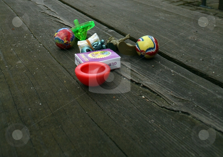 To use this stock image in your creative project, please select the size you need over to the right and click the "Add to Cart" button.
Your downloaded image will come with the Cutcaster watermark removed so don’t worry about the watermark you see on this page. Toys on Bench stock photo, Toys sitting on a bench. by Julie Bentz