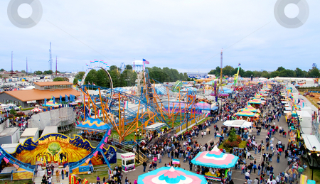 To use this stock image in your creative project, please select the size you need over to the right and click the "Add to Cart" button.
Your downloaded image will come with the Cutcaster watermark removed so don’t worry about the watermark you see on this page. Carnival Midway stock photo, The midway at a State Fair carnival. by Robert Byron