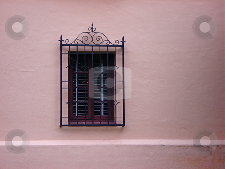 To use this stock image in your creative project, please select the size you need over to the right and click the "Add to Cart" button.
Your downloaded image will come with the Cutcaster watermark removed so don’t worry about the watermark you see on this page. Single Window stock photo, An ornate window on a salmon colored wall. by Ben O'Neal