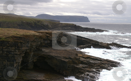 To use this stock image in your creative project, please select the size you need over to the right and click the "Add to Cart" button.
Your downloaded image will come with the Cutcaster watermark removed so don’t worry about the watermark you see on this page. Coastal cliffs stock photo, Coastal cliffs on a dark cloudy day by Karin Claus