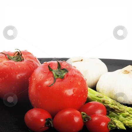 To use this stock image in your creative project, please select the size you need over to the right and click the "Add to Cart" button.
Your downloaded image will come with the Cutcaster watermark removed so don’t worry about the watermark you see on this page. Mediterranean vegetables stock photo, Plate of fresh tomatoes ;cherry tomatoes asparagus and garlic ,typical mediterranean food by Francesco Perre
