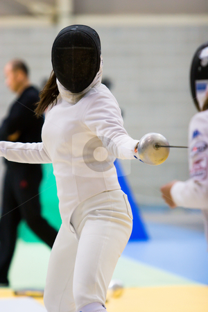 To use this stock image in your creative project, please select the size you need over to the right and click the "Add to Cart" button.
Your downloaded image will come with the Cutcaster watermark removed so don’t worry about the watermark you see on this page. Fencer stock photo, A fencer in a stance by Nicholas Rjabow