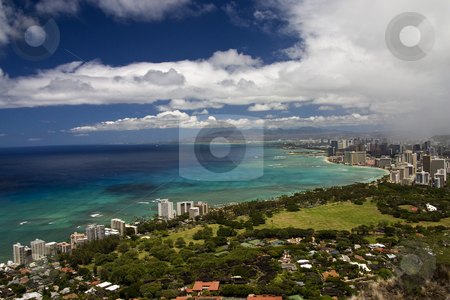 To use this stock image in your creative project, please select the size you need over to the right and click the "Add to Cart" button.
Your downloaded image will come with the Cutcaster watermark removed so don’t worry about the watermark you see on this page. Honolulu and Waikiki Beach stock photo, A rain shower approachs Honolulu, HA aid Waikiki beach. by Marc Saegesser