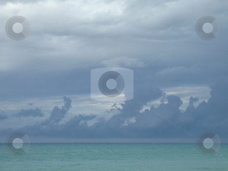 To use this stock image in your creative project, please select the size you need over to the right and click the "Add to Cart" button.
Your downloaded image will come with the Cutcaster watermark removed so don’t worry about the watermark you see on this page. Turquoise ocean and dark blue sky stock photo, Turquoise ocean and dark blue sky by Mbudley Mbudley