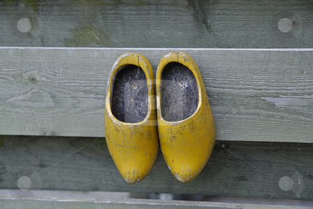 To use this stock image in your creative project, please select the size you need over to the right and click the "Add to Cart" button.
Your downloaded image will come with the Cutcaster watermark removed so don’t worry about the watermark you see on this page. Clogs stock photo, Dutch wooden shoes hanging from a rustic wooden fence by Gert-Jan Kappert