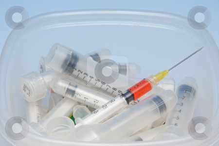 To use this stock image in your creative project, please select the size you need over to the right and click the "Add to Cart" button.
Your downloaded image will come with the Cutcaster watermark removed so don’t worry about the watermark you see on this page. Syringes stock photo, A set of syringes loaded with medication. by Robert Byron
