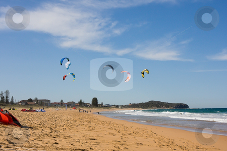 To use this stock image in your creative project, please select the size you need over to the right and click the "Add to Cart" button.
Your downloaded image will come with the Cutcaster watermark removed so don’t worry about the watermark you see on this page. Kite Surfing At The Beach stock photo, A beach scene with surf kites in the air by Nicholas Rjabow