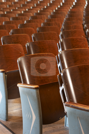 To use this stock image in your creative project, please select the size you need over to the right and click the "Add to Cart" button.
Your downloaded image will come with the Cutcaster watermark removed so don’t worry about the watermark you see on this page. Chairs in a row stock photo, Rows of wood chairs in an old auditorium by Glen Jones