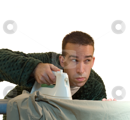To use this stock image in your creative project, please select the size you need over to the right and click the "Add to Cart" button.
Your downloaded image will come with the Cutcaster watermark removed so don’t worry about the watermark you see on this page. Laundry stock photo, A man doing his laundry and ironing his clothes by Richard Nelson