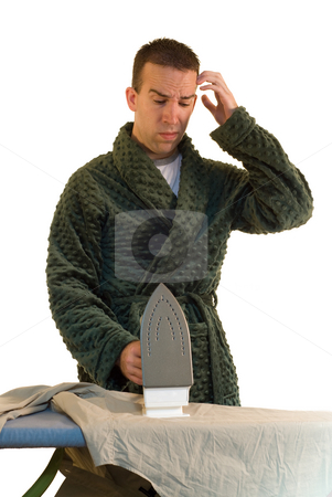 To use this stock image in your creative project, please select the size you need over to the right and click the "Add to Cart" button.
Your downloaded image will come with the Cutcaster watermark removed so don’t worry about the watermark you see on this page. Swapping Chores stock photo, A man looking confused at how to do the ironing by Richard Nelson