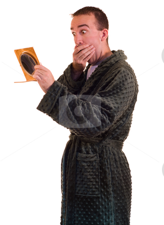 To use this stock image in your creative project, please select the size you need over to the right and click the "Add to Cart" button.
Your downloaded image will come with the Cutcaster watermark removed so don’t worry about the watermark you see on this page. Morning Surprise stock photo, A man looking in a small mirror by Richard Nelson