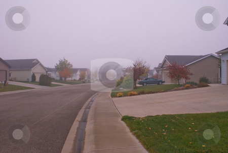 To use this stock image in your creative project, please select the size you need over to the right and click the "Add to Cart" button.
Your downloaded image will come with the Cutcaster watermark removed so don’t worry about the watermark you see on this page. Morning fog in suburbs stock photo, An autumn morning with fog by RCarner Photography
