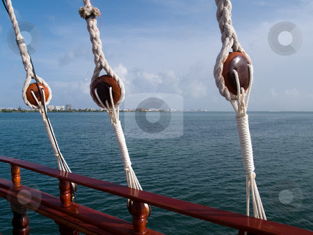 To use this stock image in your creative project, please select the size you need over to the right and click the "Add to Cart" button.
Your downloaded image will come with the Cutcaster watermark removed so don’t worry about the watermark you see on this page. Romantic Cancun Bay Cruise stock photo, Looking over the rail toward shore during an evening dinner cruise. by Gary W. Sherwin