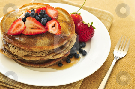 To use this stock image in your creative project, please select the size you need over to the right and click the "Add to Cart" button.
Your downloaded image will come with the Cutcaster watermark removed so don’t worry about the watermark you see on this page. Stack of pancakes stock photo, Stack of buckwheat pancakes with fresh berries and maple syrup by Elena Elisseeva