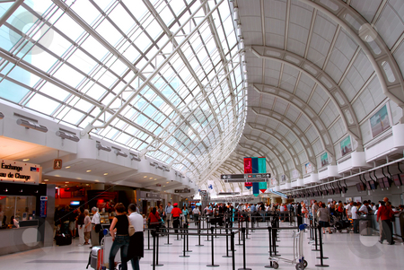 To use this stock image in your creative project, please select the size you need over to the right and click the "Add to Cart" button.
Your downloaded image will come with the Cutcaster watermark removed so don’t worry about the watermark you see on this page. Airport crowd stock photo, Passengers lining up at check-in counter at the modern international airport by Elena Elisseeva