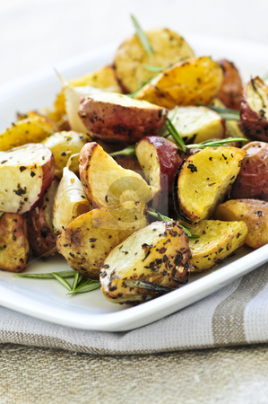 To use this stock image in your creative project, please select the size you need over to the right and click the "Add to Cart" button.
Your downloaded image will come with the Cutcaster watermark removed so don’t worry about the watermark you see on this page. Roasted potatoes stock photo, Herb roasted potatoes served on a plate by Elena Elisseeva