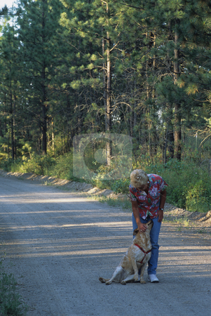 To use this stock image in your creative project, please select the size you need over to the right and click the "Add to Cart" button.
Your downloaded image will come with the Cutcaster watermark removed so don’t worry about the watermark you see on this page. Woman And Her Dog stock photo, Woman Walking Her Dog Down A Rural Road by Mallorey Orcutt