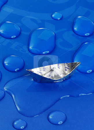 To use this stock image in your creative project, please select the size you need over to the right and click the "Add to Cart" button.
Your downloaded image will come with the Cutcaster watermark removed so don’t worry about the watermark you see on this page. Paper boat stock photo, Paper boat floating on water drops ,over blue background by Francesco Perre