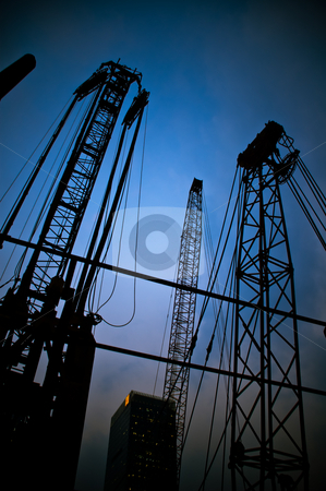 To use this stock image in your creative project, please select the size you need over to the right and click the "Add to Cart" button.
Your downloaded image will come with the Cutcaster watermark removed so don’t worry about the watermark you see on this page. Construction cranes stock photo, Construction cranes on night ove a blue sky by Francesco Perre