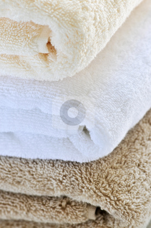 To use this stock image in your creative project, please select the size you need over to the right and click the "Add to Cart" button.
Your downloaded image will come with the Cutcaster watermark removed so don’t worry about the watermark you see on this page. Stack of towels stock photo, Background of soft stacked towels close up by Elena Elisseeva