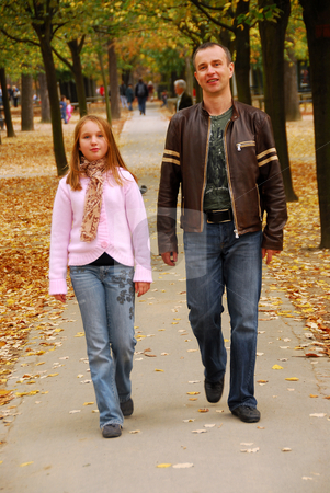 To use this stock image in your creative project, please select the size you need over to the right and click the "Add to Cart" button.
Your downloaded image will come with the Cutcaster watermark removed so don’t worry about the watermark you see on this page. Father daughter walk stock photo, Father and daughter taking a walk in an autumn park by Elena Elisseeva