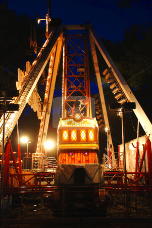 To use this stock image in your creative project, please select the size you need over to the right and click the "Add to Cart" button.
Your downloaded image will come with the Cutcaster watermark removed so don’t worry about the watermark you see on this page. Carousel in evening park stock photo, Illuminated Construction of carousel in evening park by Julija Sapic
