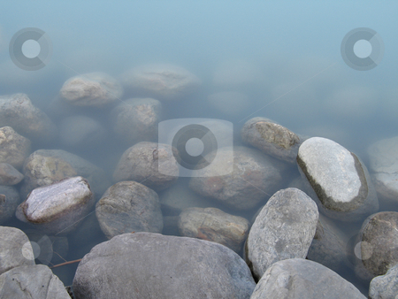 To use this stock image in your creative project, please select the size you need over to the right and click the "Add to Cart" button.
Your downloaded image will come with the Cutcaster watermark removed so don’t worry about the watermark you see on this page. Rocks & water stock photo, by Mbudley Mbudley
