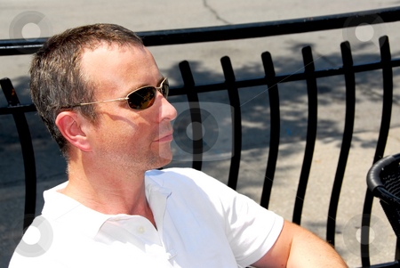 To use this stock image in your creative project, please select the size you need over to the right and click the "Add to Cart" button.
Your downloaded image will come with the Cutcaster watermark removed so don’t worry about the watermark you see on this page. Man sunglasses stock photo, Portrait of a man wearing sunglasses in outdoor cafe by Elena Elisseeva
