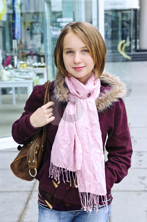 To use this stock image in your creative project, please select the size you need over to the right and click the "Add to Cart" button.
Your downloaded image will come with the Cutcaster watermark removed so don’t worry about the watermark you see on this page. Teenage girl shopping stock photo, Teenage girl window shopping on city street by Elena Elisseeva