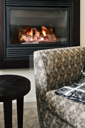 To use this stock image in your creative project, please select the size you need over to the right and click the "Add to Cart" button.
Your downloaded image will come with the Cutcaster watermark removed so don’t worry about the watermark you see on this page. Fireplace and armchair stock photo, Fireplace and cozy armchair in living room by Elena Elisseeva
