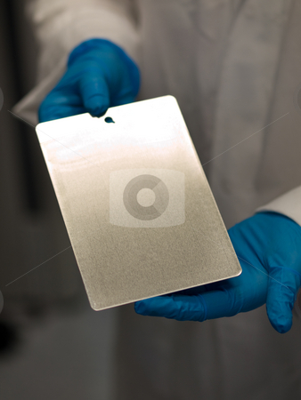 To use this stock image in your creative project, please select the size you need over to the right and click the "Add to Cart" button.
Your downloaded image will come with the Cutcaster watermark removed so don’t worry about the watermark you see on this page. Scientist at work stock photo, Scientist at work holding a test coating plate by Laurent Dambies