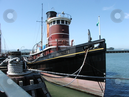 To use this stock image in your creative project, please select the size you need over to the right and click the "Add to Cart" button.
Your downloaded image will come with the Cutcaster watermark removed so don’t worry about the watermark you see on this page. The Hercules Steam Powered Tugboat stock photo, The Hercules, a steam powered tugboat built in 1907, is one of six larger vessels housed in the San Francisco National Historic Park located at the historic Hyde Park Pier. In earlier days the pier was the destination for ferry boats transporting cars and people to the city. by Dennis Thomsen