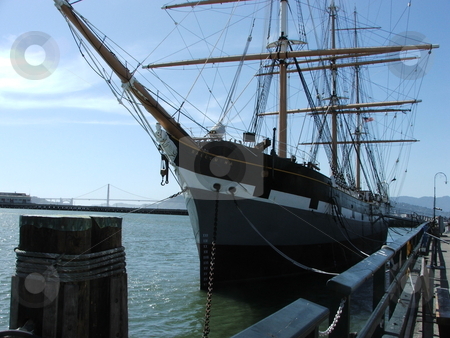 To use this stock image in your creative project, please select the size you need over to the right and click the "Add to Cart" button.
Your downloaded image will come with the Cutcaster watermark removed so don’t worry about the watermark you see on this page. The 1886 square-rigged ship Balclutha stock photo, The 1886 square rigger Balclutha is one of several ships displayed in the San Francisco Maritime National Historic Park located at the old Hyde Park Pier near Fisherman's Wharf. The ship was built in Scotland and used to carry a variety of cargo around the world. by Dennis Thomsen
