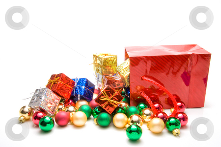 To use this stock image in your creative project, please select the size you need over to the right and click the "Add to Cart" button.
Your downloaded image will come with the Cutcaster watermark removed so don’t worry about the watermark you see on this page. Christmas Ornaments stock photo, A pile of Christmas ornaments in a gift bag. by Robert Byron