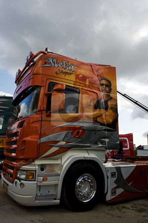 To use this stock image in your creative project, please select the size you need over to the right and click the "Add to Cart" button.
Your downloaded image will come with the Cutcaster watermark removed so don’t worry about the watermark you see on this page. American Chopper concept truck Scania stock photo, Scania truck decorated with clearly inspiration from the orange county chopper series. by Flemming Jacobsen