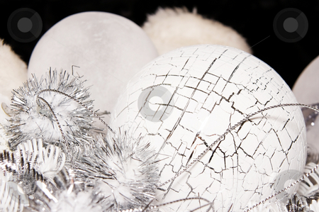 To use this stock image in your creative project, please select the size you need over to the right and click the "Add to Cart" button.
Your downloaded image will come with the Cutcaster watermark removed so don’t worry about the watermark you see on this page. Xmas decoration ornaments stock photo, Xmas decoration ornaments in white and silver by Karin Claus