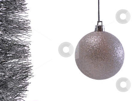 To use this stock image in your creative project, please select the size you need over to the right and click the "Add to Cart" button.
Your downloaded image will come with the Cutcaster watermark removed so don’t worry about the watermark you see on this page. Silver Christmas Ornament stock photo, by Corinna Walby