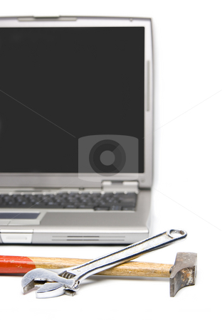 To use this stock image in your creative project, please select the size you need over to the right and click the "Add to Cart" button.
Your downloaded image will come with the Cutcaster watermark removed so don’t worry about the watermark you see on this page. Laptop and tools stock photo, Conceptual technology and help. Computer and tools. by Ivan Montero