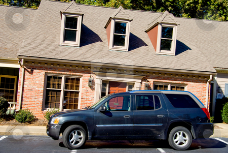 To use this stock image in your creative project, please select the size you need over to the right and click the "Add to Cart" button.
Your downloaded image will come with the Cutcaster watermark removed so don’t worry about the watermark you see on this page. Leaning Apartments stock photo, An SUV parked in fron of a leaning apartment building. by Robert Byron