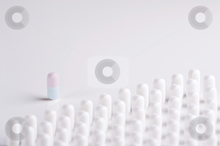 To use this stock image in your creative project, please select the size you need over to the right and click the "Add to Cart" button.
Your downloaded image will come with the Cutcaster watermark removed so don’t worry about the watermark you see on this page. Pill Leader stock photo, A Pill leader in colour addresses lines of white pills by Steve Smith