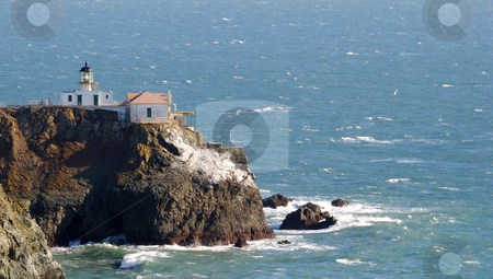 To use this stock image in your creative project, please select the size you need over to the right and click the "Add to Cart" button.
Your downloaded image will come with the Cutcaster watermark removed so don’t worry about the watermark you see on this page. Lighthouse stock photo, Lighthouse on a rocky coast overlooking the ocean by Denis Radovanovic